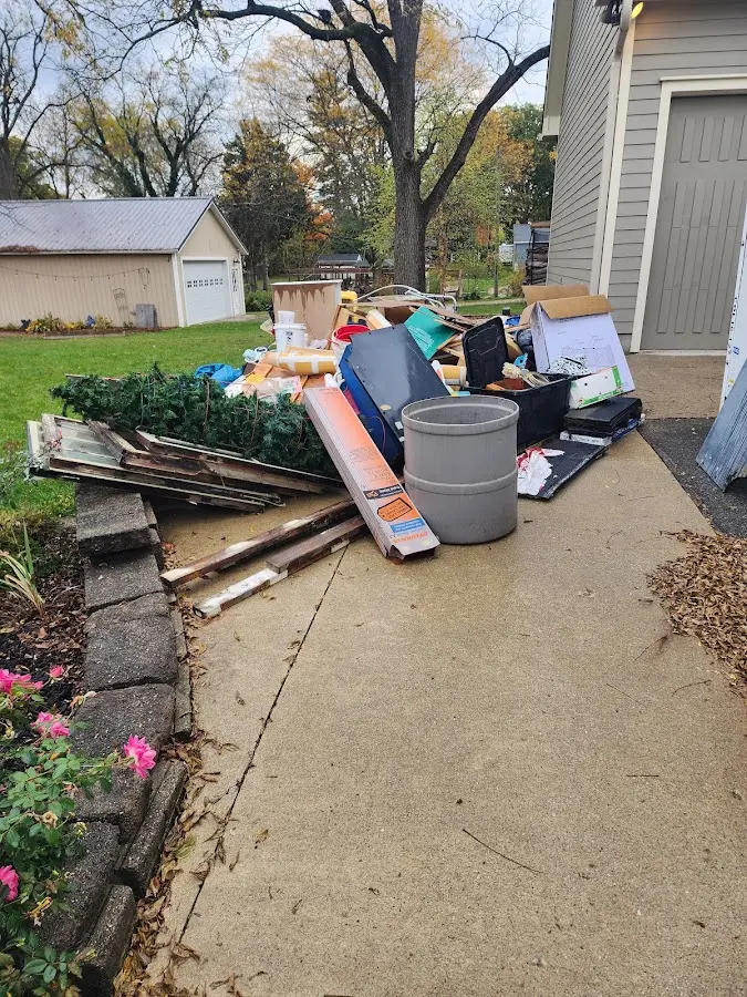 Dumpster being loaded with debris for Residential Dumpster Rental in Dunellen